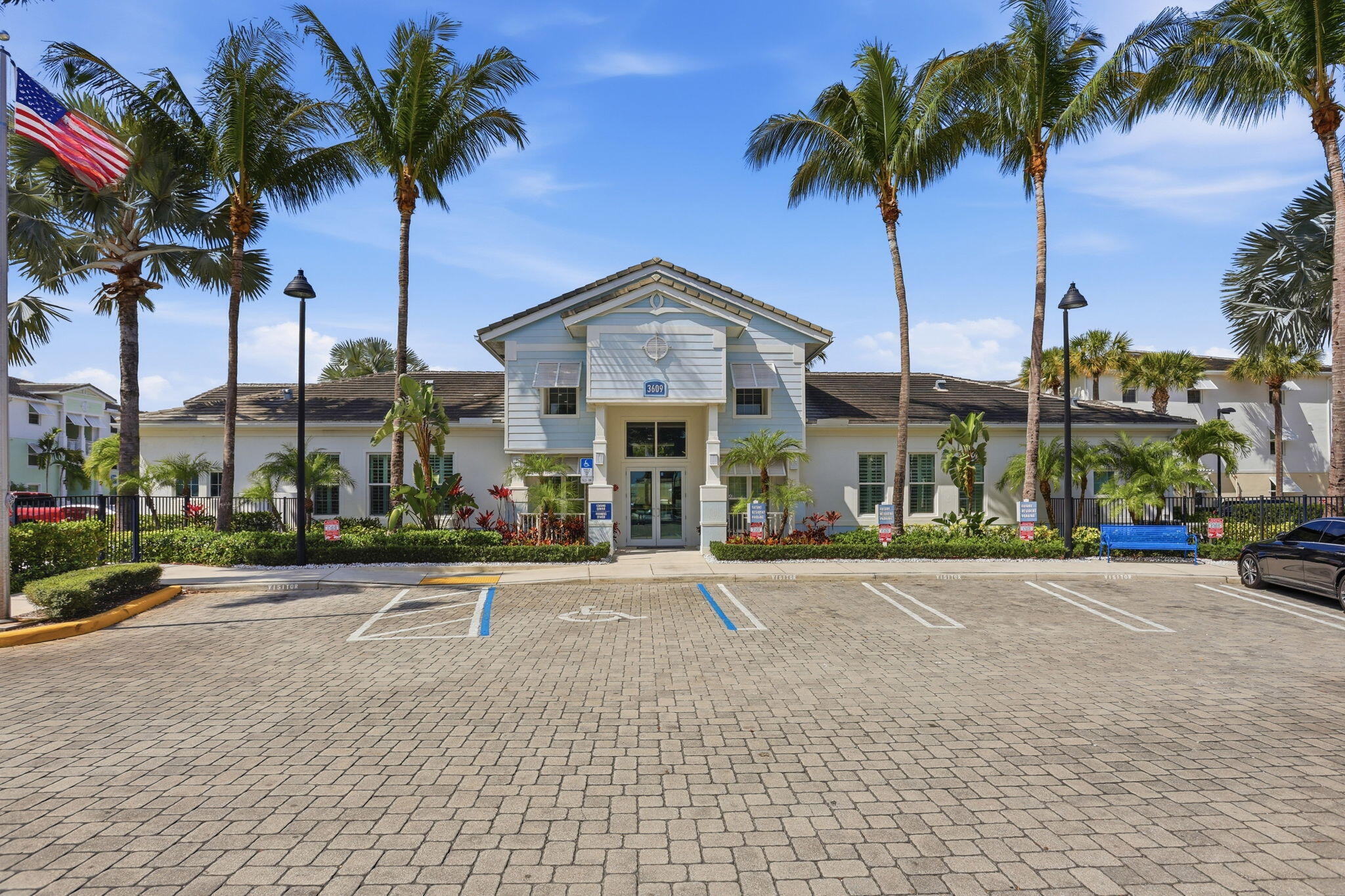 3613 High Ridge Road, Unit 304 Boynton Beach, FL 33426 - Photo 32 of 32 a front view of multiple houses with a yard and palm trees