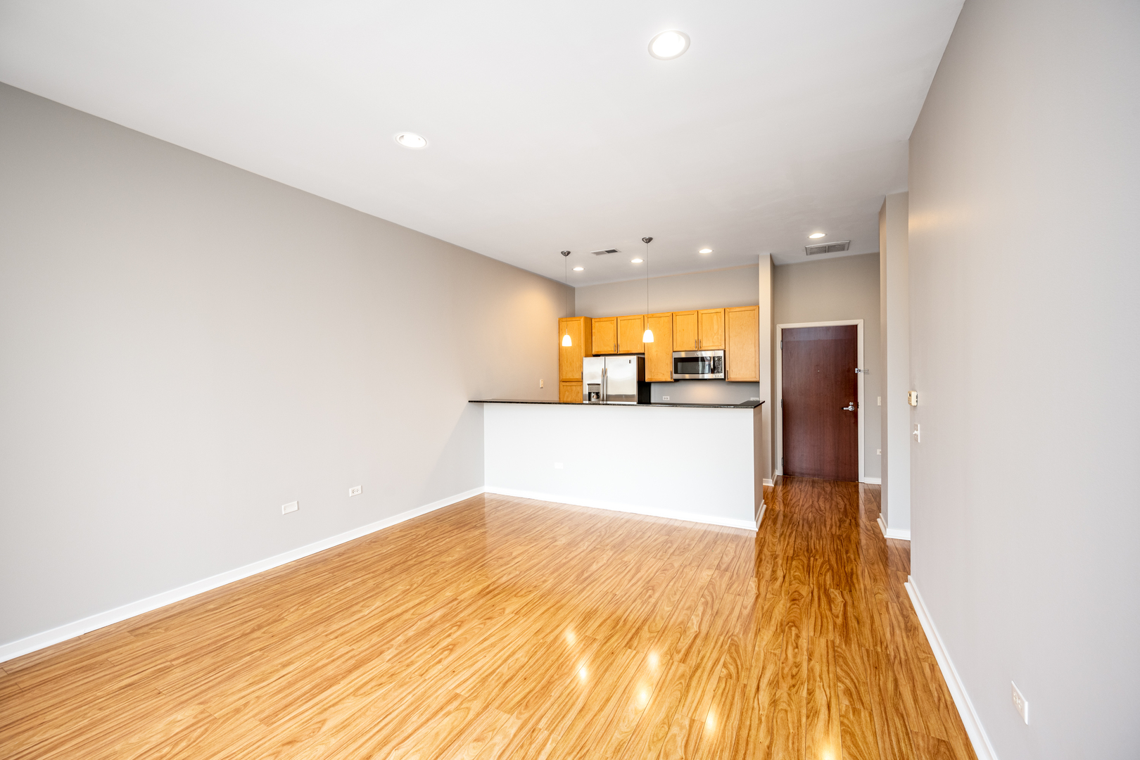 3920 North Sheridan Road, Unit 406 Chicago, IL 60613 - Photo 3 of 12 a view of a kitchen with a sink and cabinets