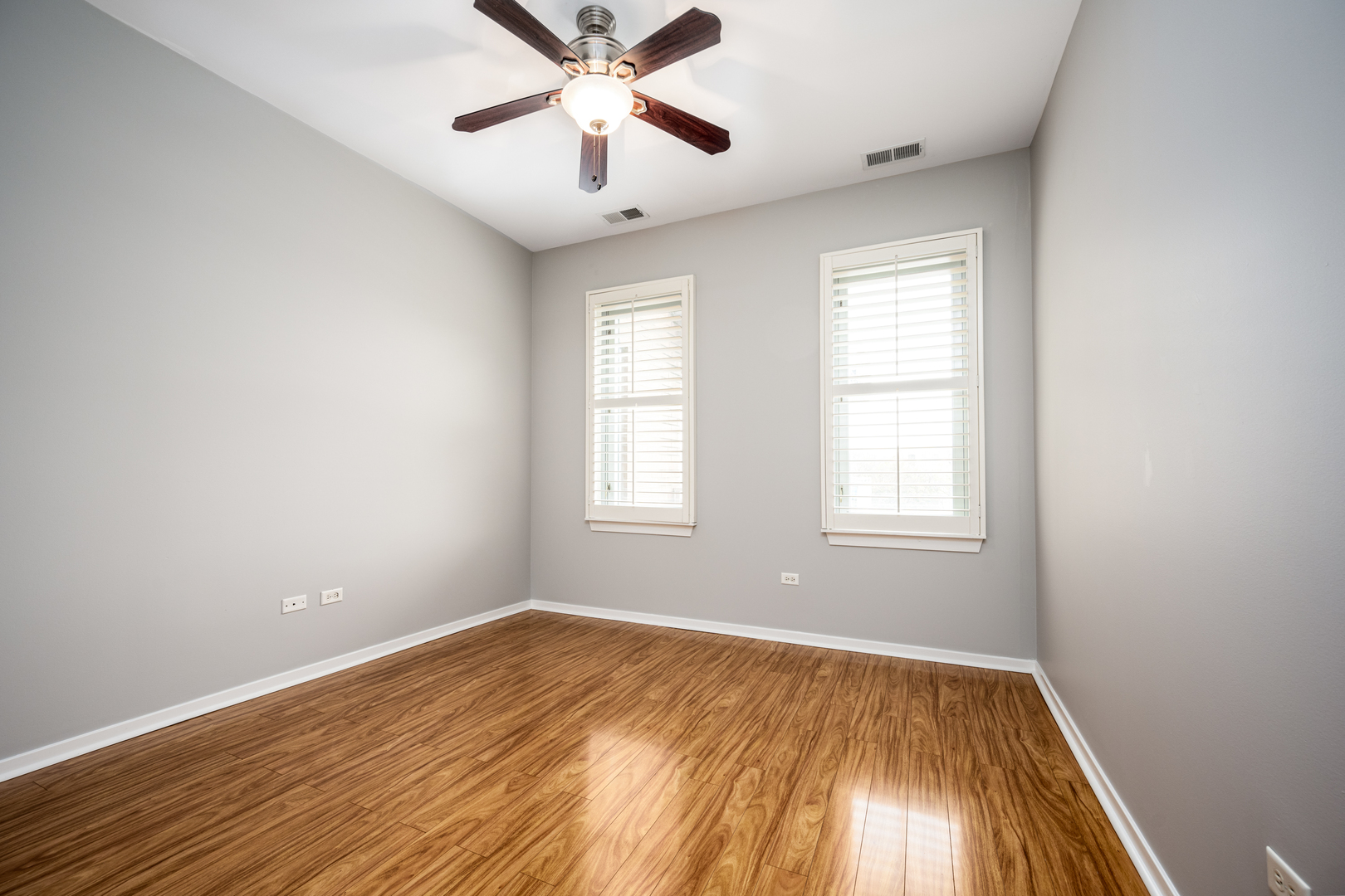 3920 North Sheridan Road, Unit 406 Chicago, IL 60613 - Photo 6 of 12 an empty room with a window and a fan