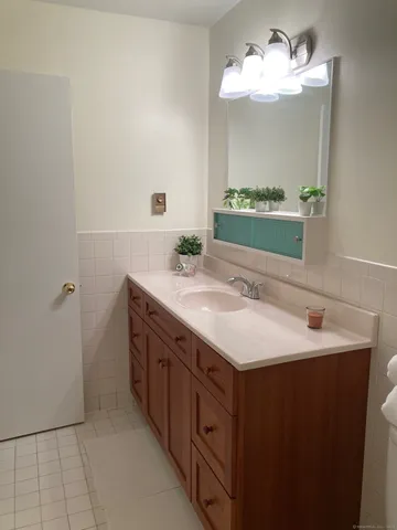 a bathroom with a toilet and a bathtub