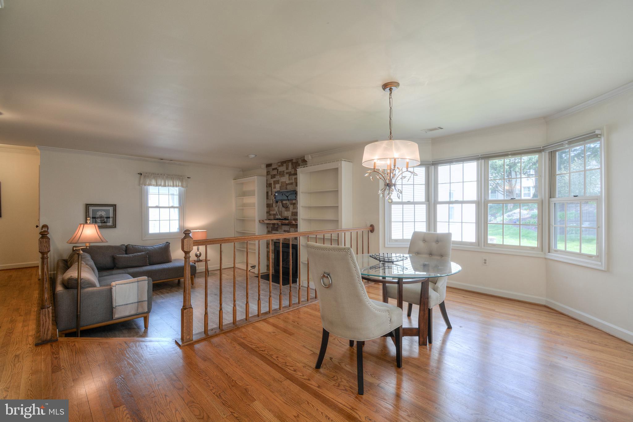 2457 Bear Den Road Frederick, MD 21701 - Photo 6 of 36 a view of a dining room with furniture window and wooden floor