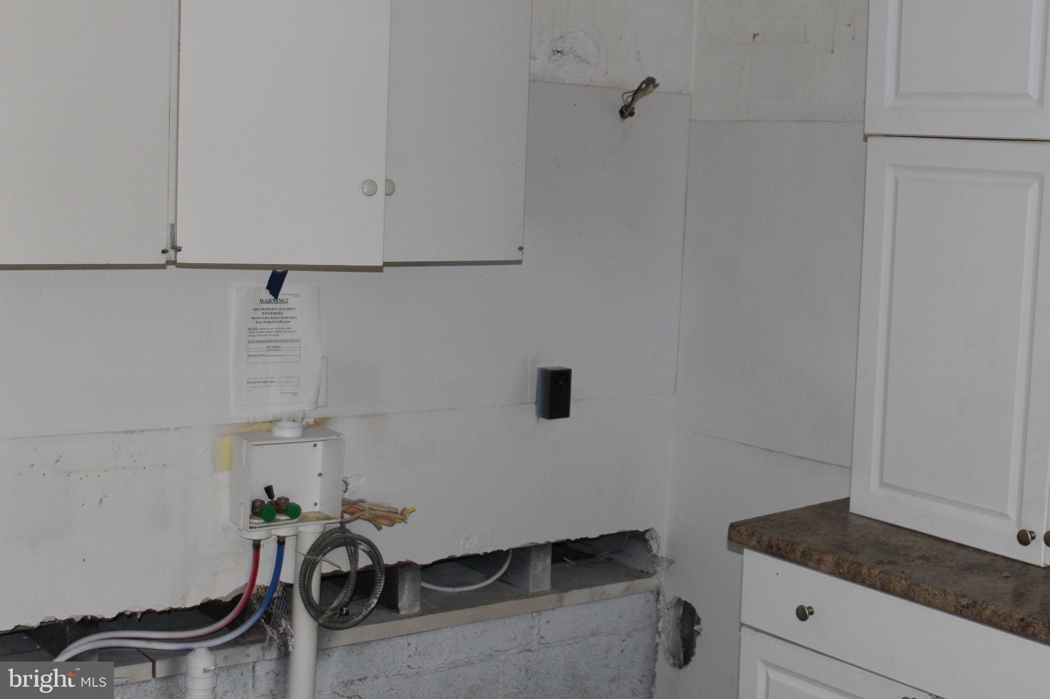 1048 Upper River Road Ewing, NJ 08628 - Photo 8 of 16 a view of a storage and utility room with racks on the wall