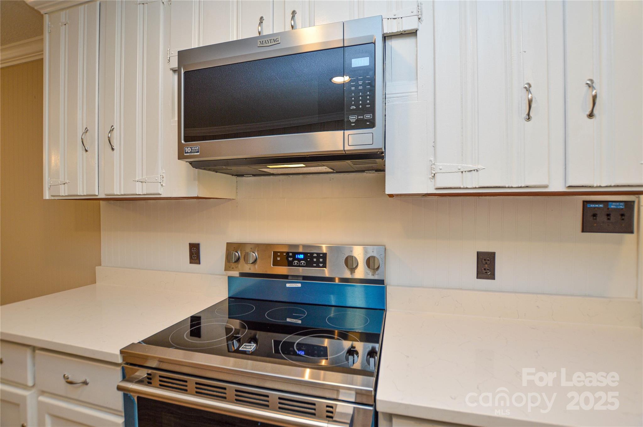 2511 Woodstar Road Matthews, NC 28105 - Photo 14 of 21 a kitchen with a stove and a microwave
