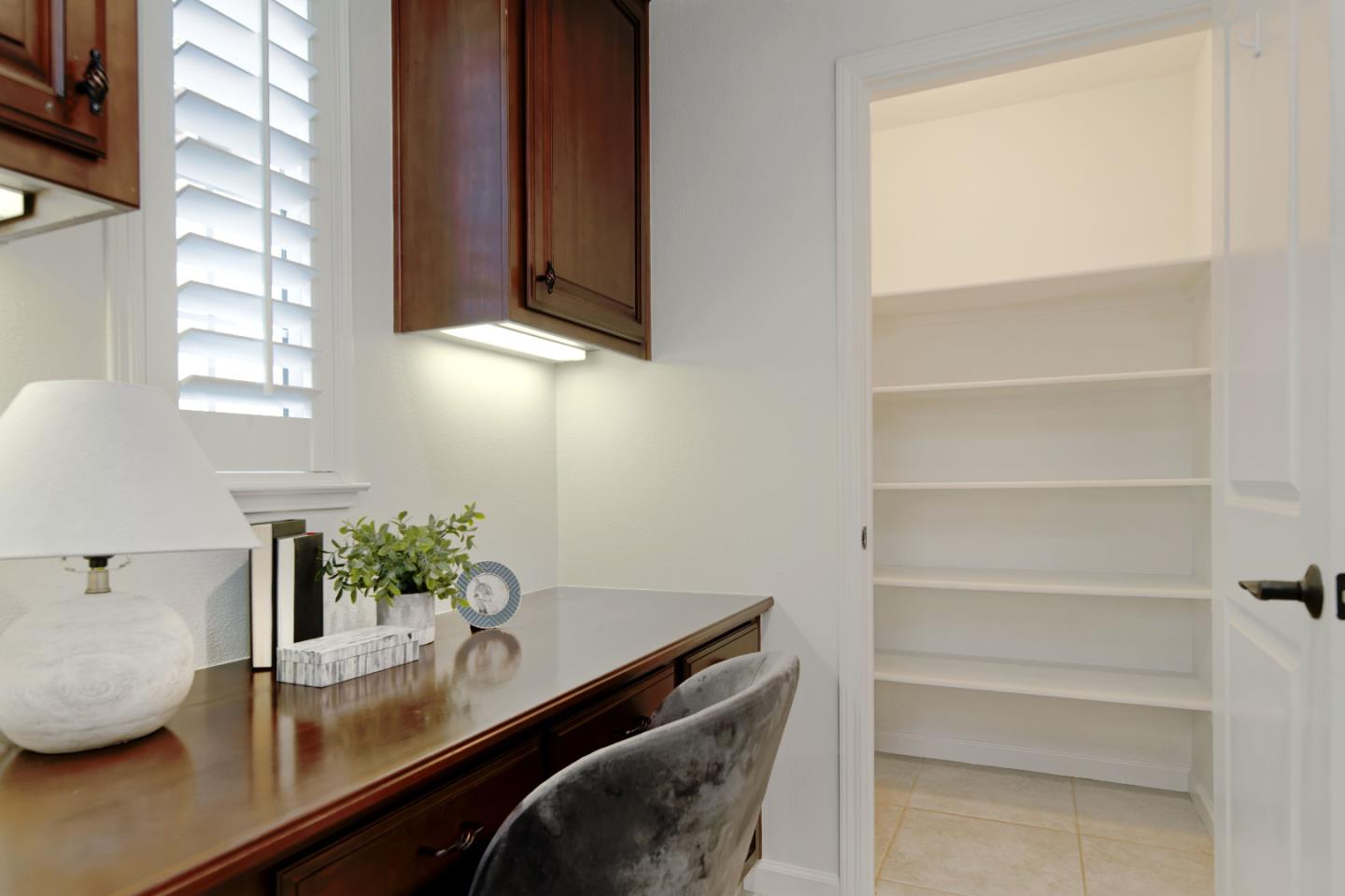 7160 Eagle Ridge Drive Gilroy, CA 95020 - Photo 21 of 80 a view of bathroom with a potted plant on the counter and a window