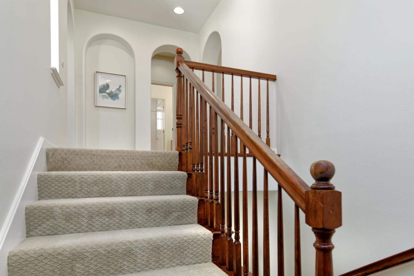 7160 Eagle Ridge Drive Gilroy, CA 95020 - Photo 25 of 80 a view of staircase with lots of frames on wall