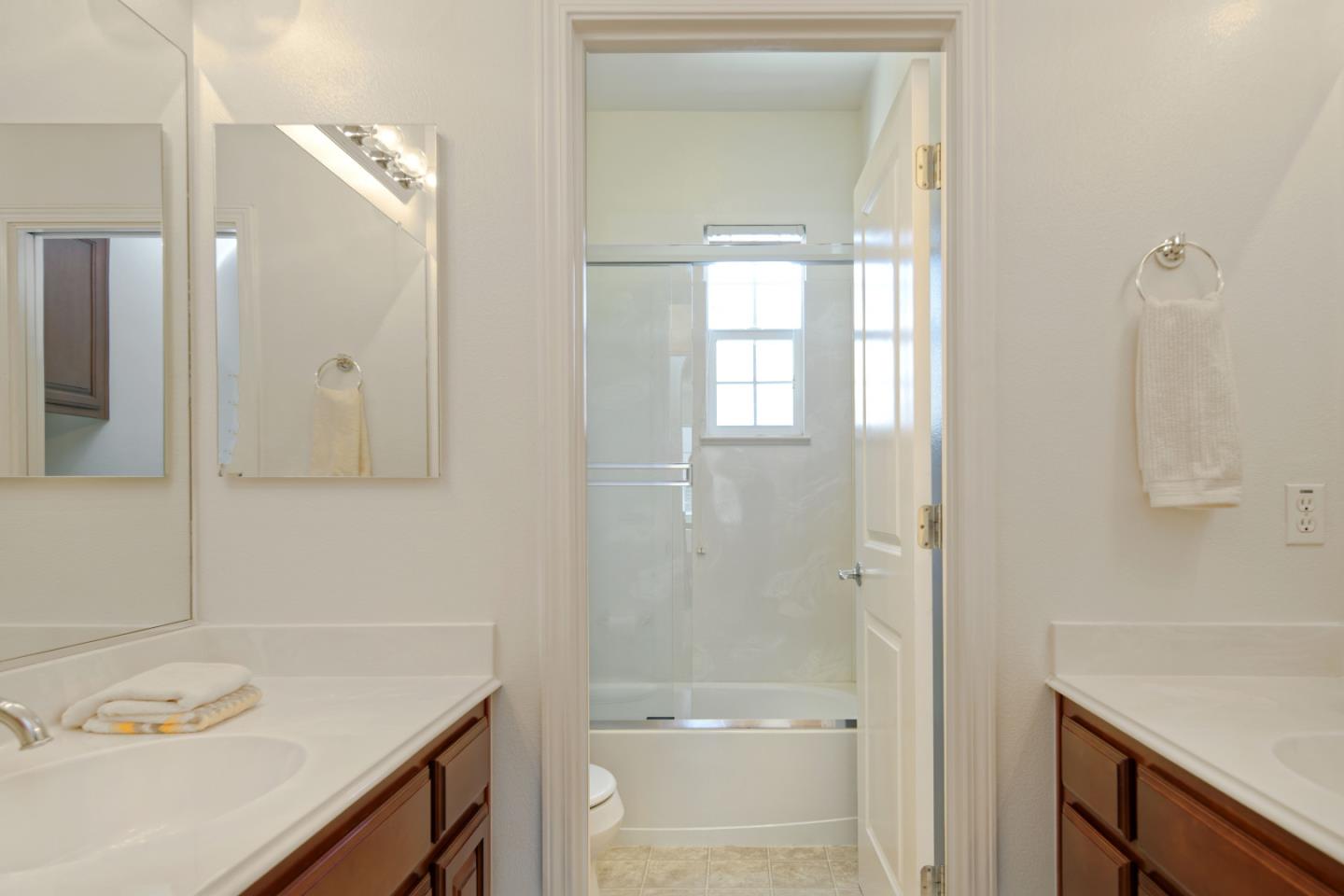 7160 Eagle Ridge Drive Gilroy, CA 95020 - Photo 28 of 80 a bathroom with a granite countertop sink a toilet and shower