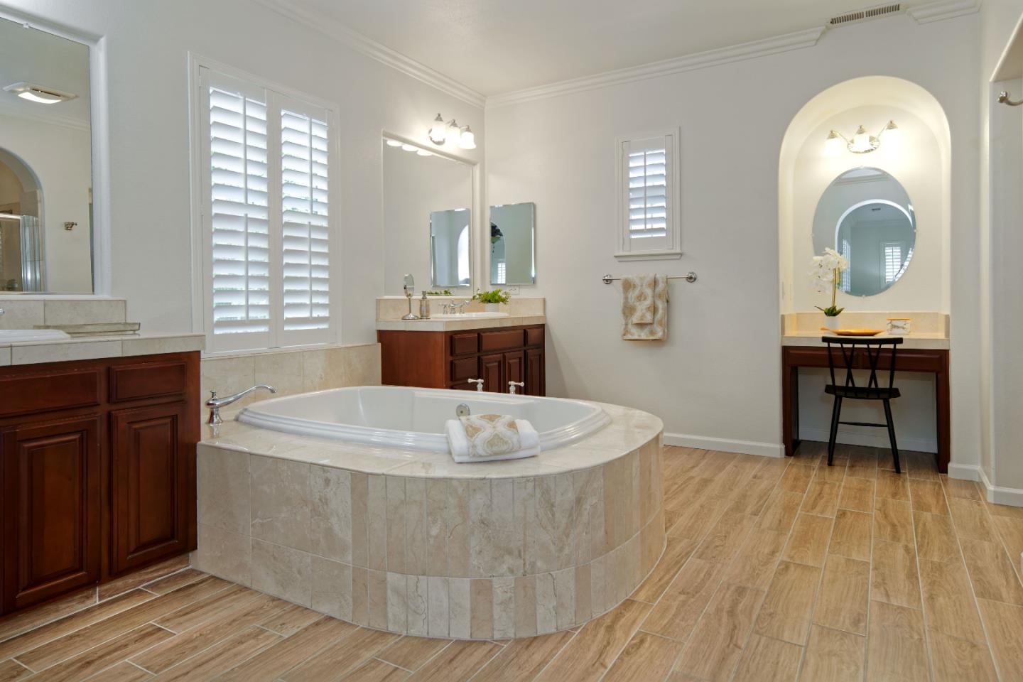 7160 Eagle Ridge Drive Gilroy, CA 95020 - Photo 38 of 80 a spacious bathroom with a tub a sink and mirror
