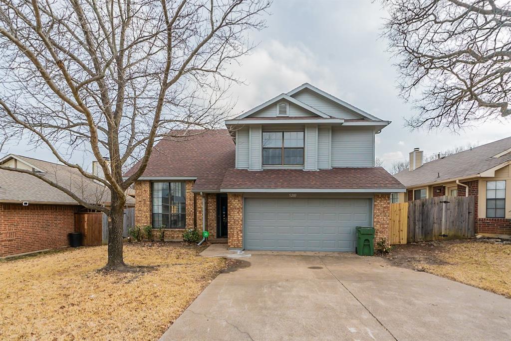 5200 Foley Drive Arlington, TX 76013 - Photo 1 of 1 a front view of a house with a yard and garage