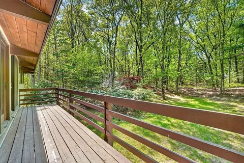 a view of balcony and yard