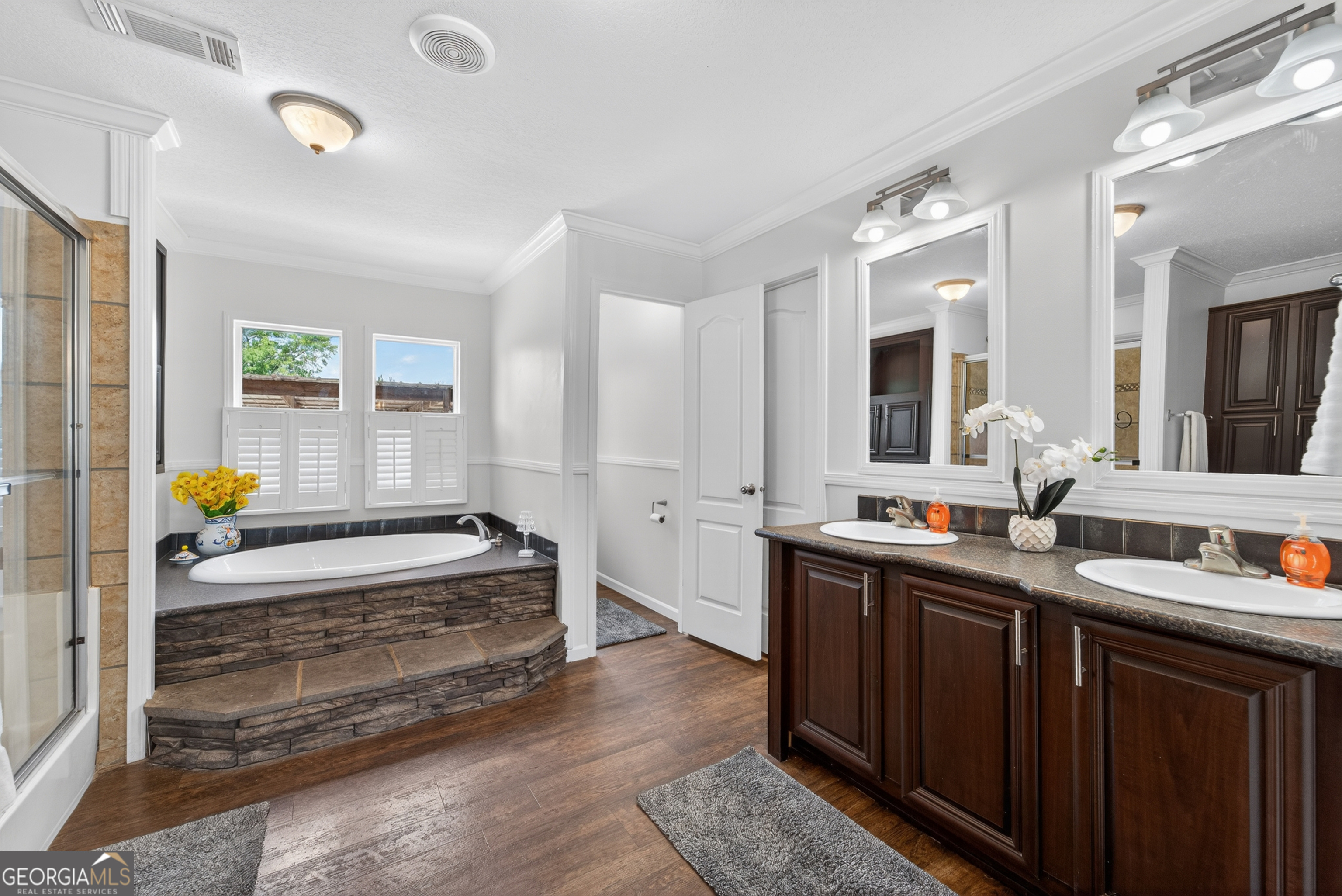 1953 Raybon Road West Hoboken, GA 31542 - Photo 15 of 31 a spacious bathroom with double vanity and a bathtub