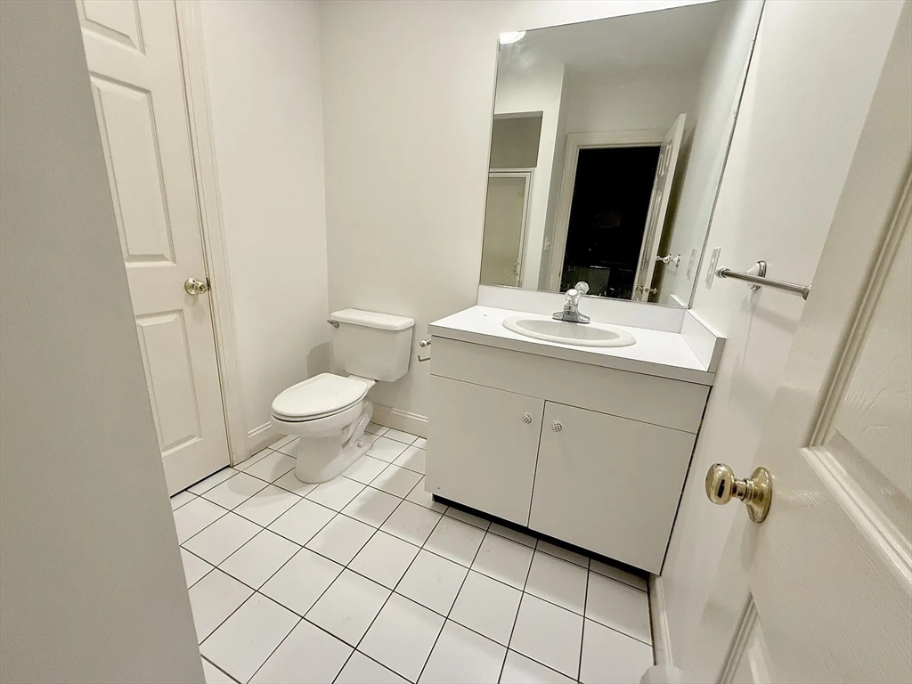 4 Elliston Road Weston, MA 02493 - Photo 16 of 36 a bathroom with a sink and a mirror