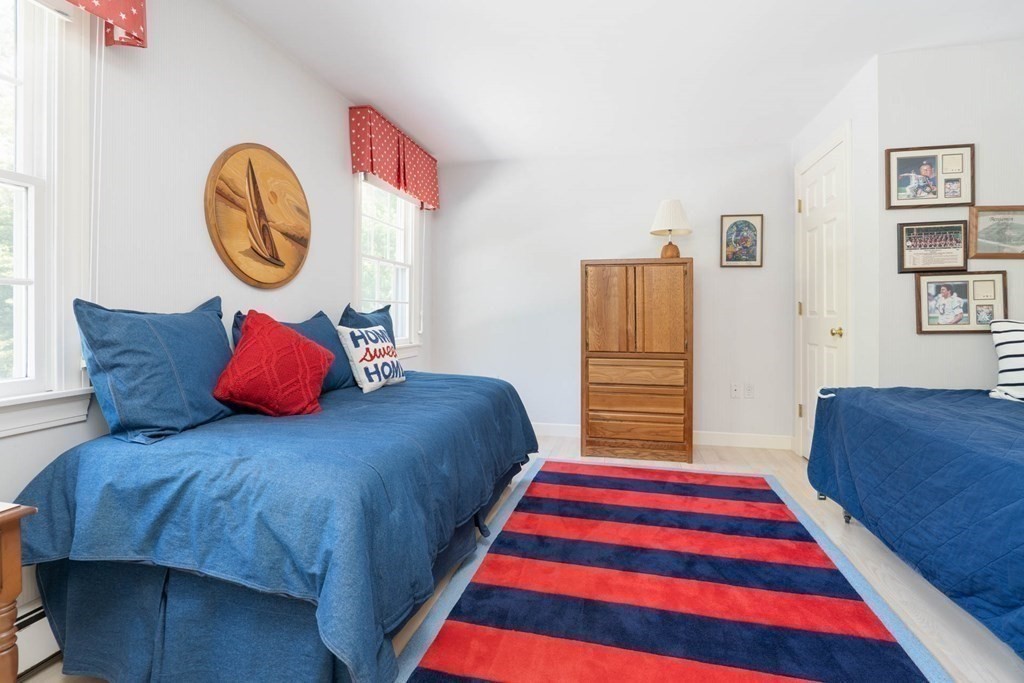 4 Elliston Road Weston, MA 02493 - Photo 22 of 36 a bedroom with a bed and a painting on the wall