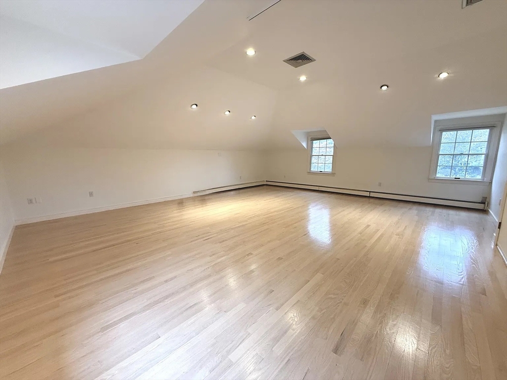 4 Elliston Road Weston, MA 02493 - Photo 23 of 36 an empty room with wooden floor and windows