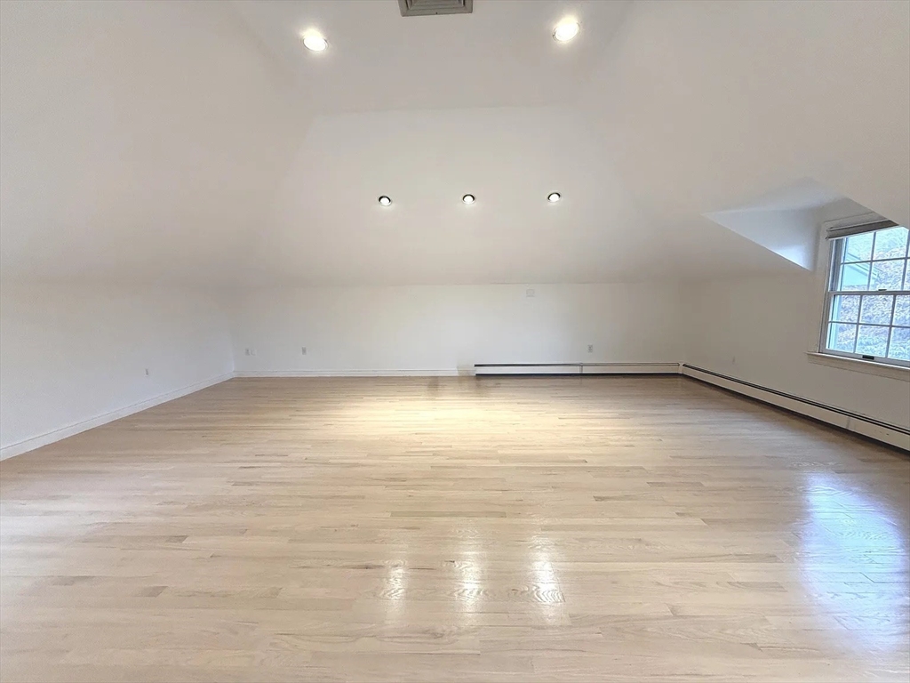 4 Elliston Road Weston, MA 02493 - Photo 24 of 36 an empty room with wooden floor and windows