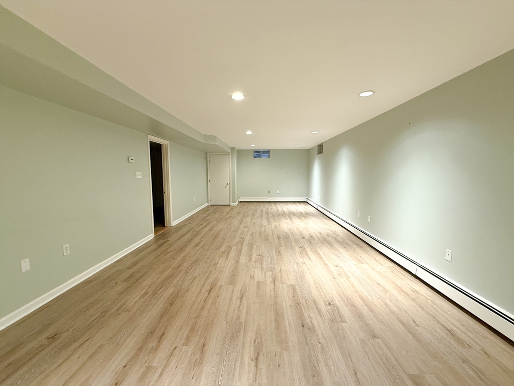 4 Elliston Road Weston, MA 02493 - Photo 25 of 36 a view of empty room with wooden floor