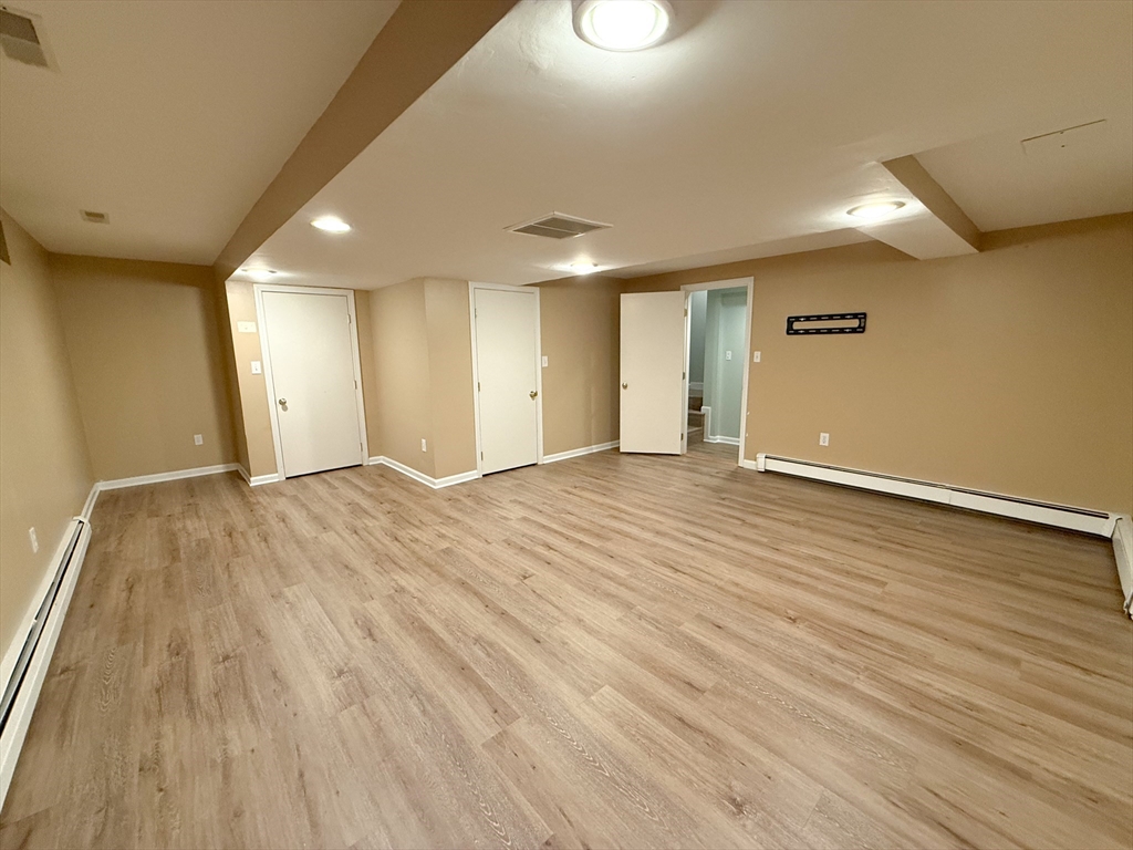 4 Elliston Road Weston, MA 02493 - Photo 26 of 36 a view of an empty room with wooden floor