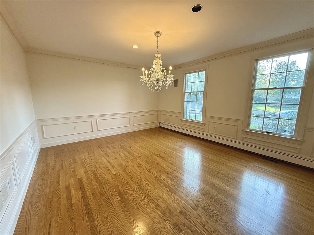 4 Elliston Road Weston, MA 02493 - Photo 7 of 36 a view of room with window and wooden floor