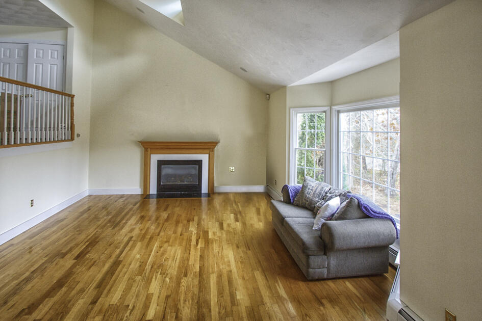 488 Upper County Road Dennis Port, MA 02639 - Photo 12 of 35 a bedroom with a bed and a couch