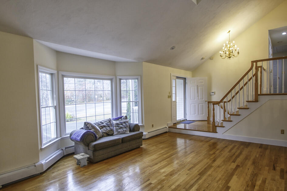 488 Upper County Road Dennis Port, MA 02639 - Photo 13 of 35 a living room with furniture and a hard wood floor