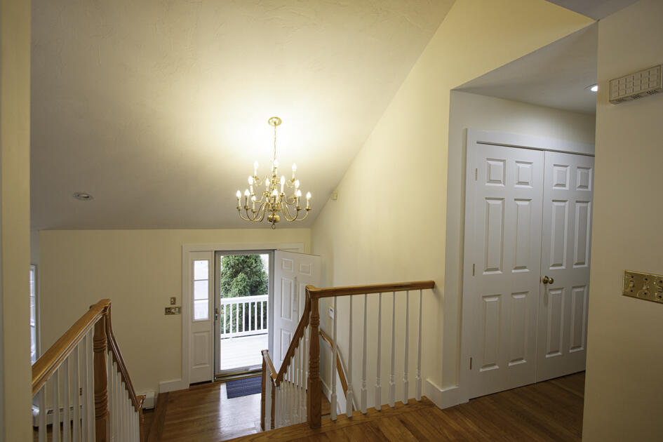 488 Upper County Road Dennis Port, MA 02639 - Photo 26 of 35 a view of a bedroom with wooden floor and windows