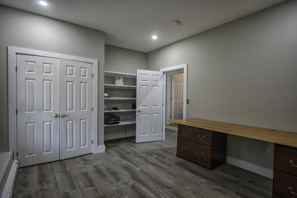 488 Upper County Road Dennis Port, MA 02639 - Photo 27 of 35 a room with a closet and wooden closet
