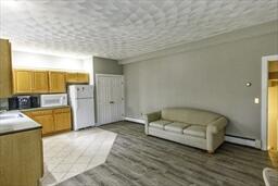 488 Upper County Road Dennis Port, MA 02639 - Photo 30 of 35 a spacious bedroom with a bed and a cabinets