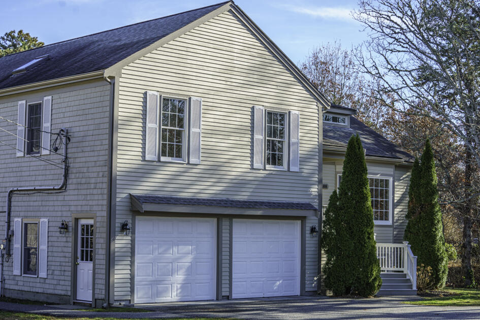 488 Upper County Road Dennis Port, MA 02639 - Photo 5 of 35 a view of a house with a yard and potted plants