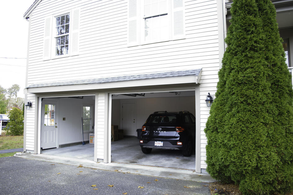 488 Upper County Road Dennis Port, MA 02639 - Photo 6 of 35 a car parked in front of a house