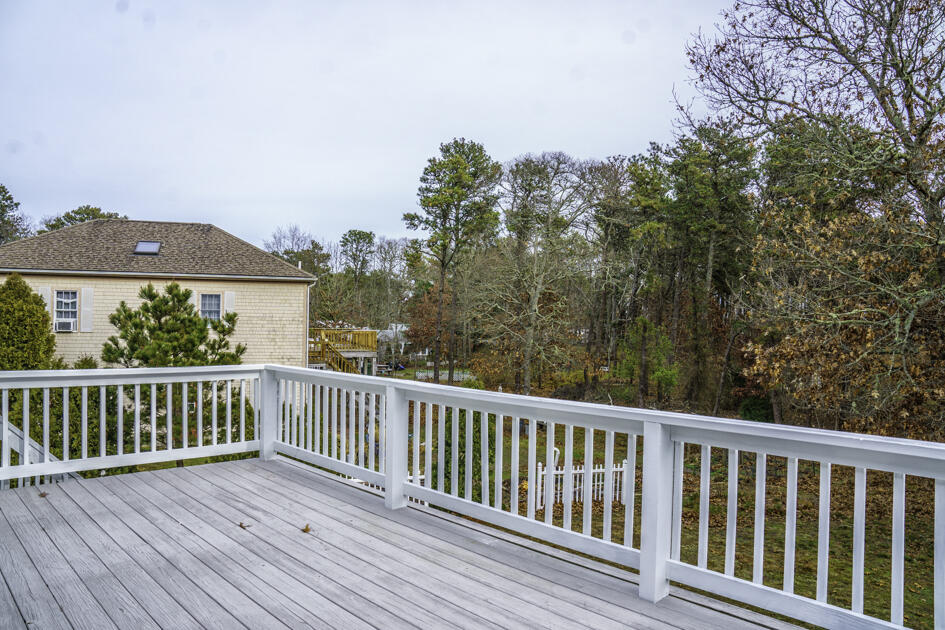 488 Upper County Road Dennis Port, MA 02639 - Photo 8 of 35 a view of a wooden roof deck