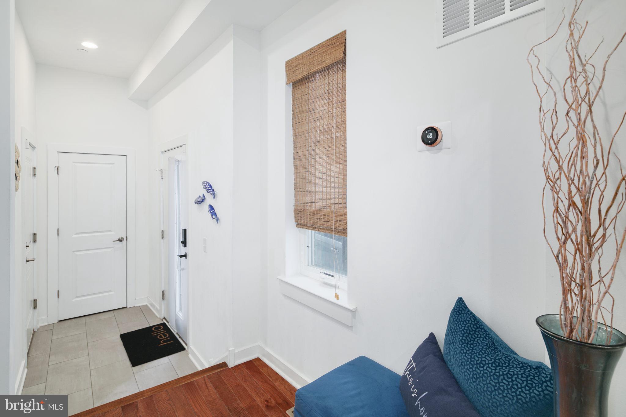 159 East Allen Street, Unit 1 Philadelphia, PA 19125 - Photo 5 of 45 a bedroom with a bed and a couch