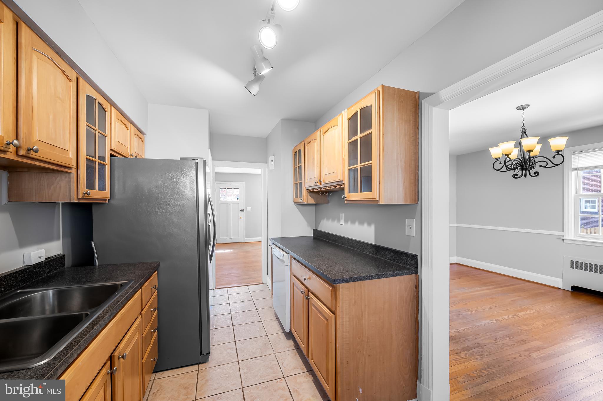 400 Regester Avenue Baltimore, MD 21212 - Photo 12 of 38 a kitchen with stainless steel appliances granite countertop a sink and a refrigerator