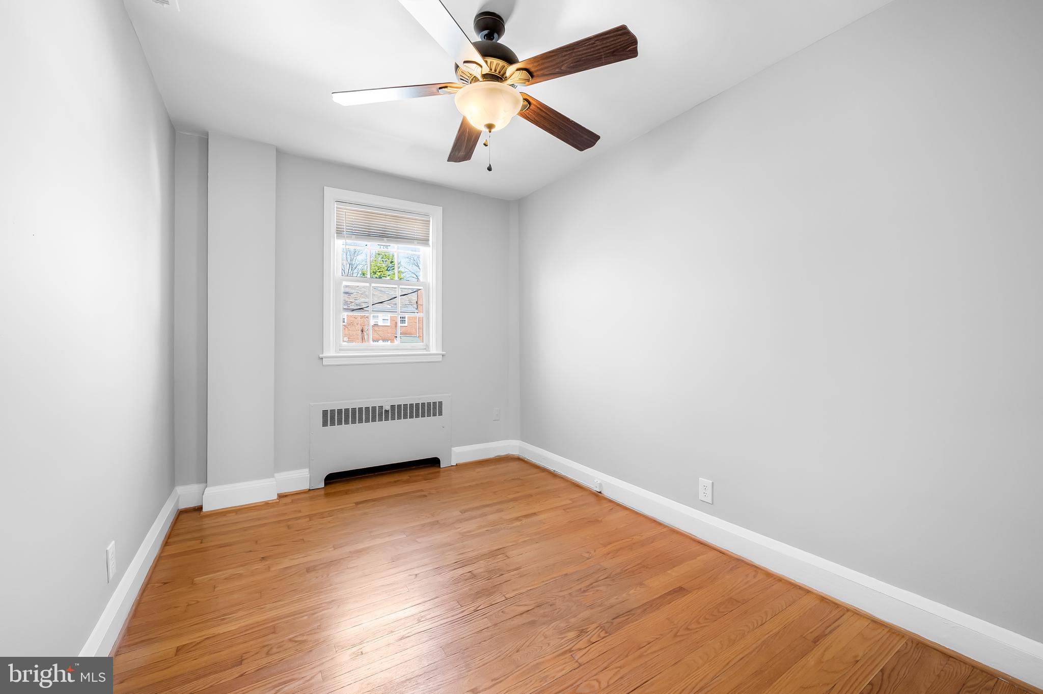 400 Regester Avenue Baltimore, MD 21212 - Photo 16 of 38 an empty room with windows and fan
