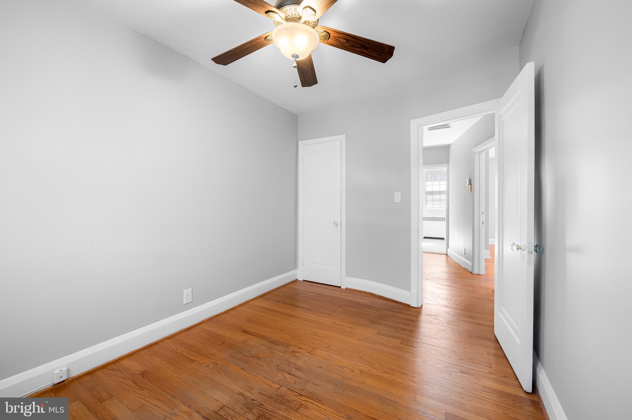400 Regester Avenue Baltimore, MD 21212 - Photo 17 of 38 a view of a big room with wooden floor and a chandelier fan