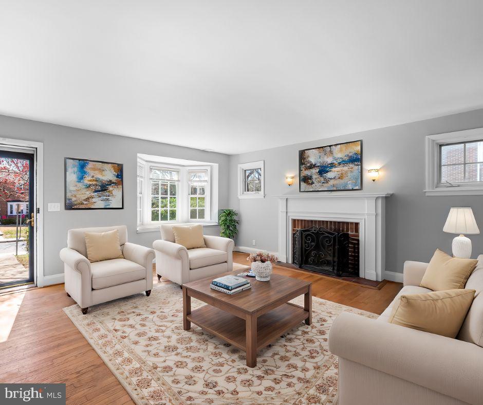 400 Regester Avenue Baltimore, MD 21212 - Photo 4 of 38 a living room with furniture and a fireplace