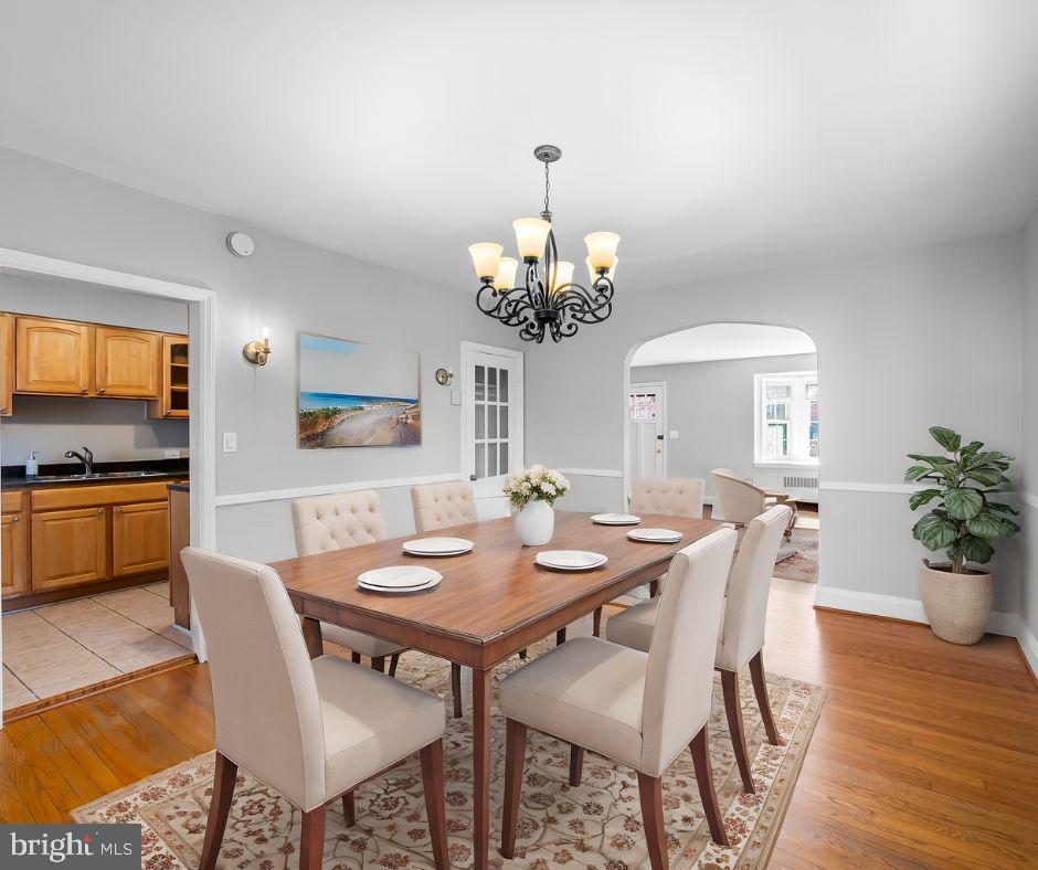 400 Regester Avenue Baltimore, MD 21212 - Photo 10 of 38 a view of a dining room with furniture and wooden floor