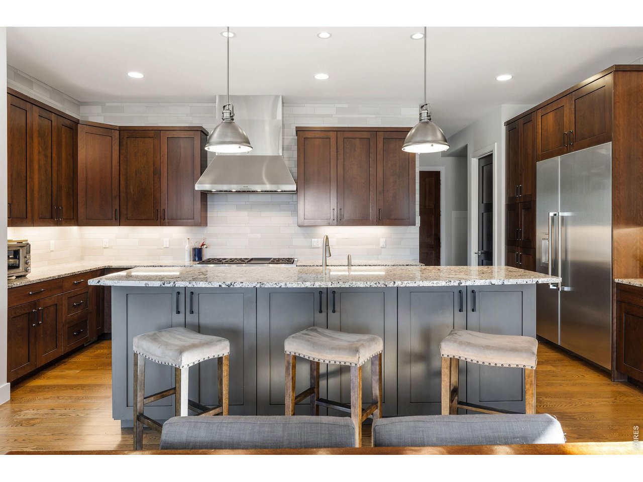 1525 Jennine Place Boulder, CO 80304 - Photo 12 of 50 In the gourmet open kitchen, custom cabinetry, granite counters and tile backsplashes surround top-of-the-line stainless steel appliances.