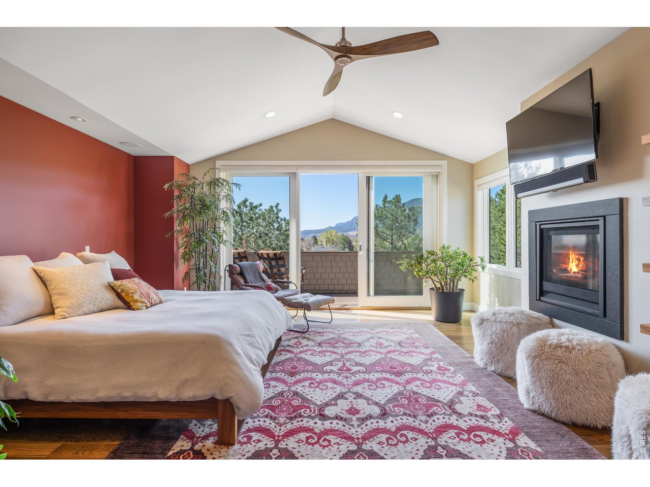 1525 Jennine Place Boulder, CO 80304 - Photo 26 of 50 A king-size bedroom impresses with vaulted ceilings, a gas fireplace, a south-facing balcony, and an en suite spa bathroom.