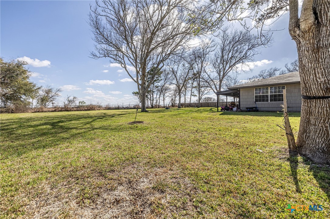 743 Royal Road Port Lavaca, TX 77979 - Photo 13 of 21 a view of a yard with a house and large trees