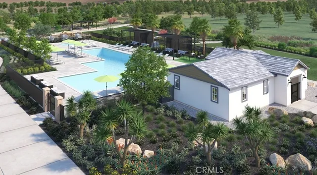 a view of swimming pool with outdoor seating and plants