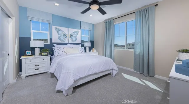 a living room with furniture a chandelier and a flat screen tv
