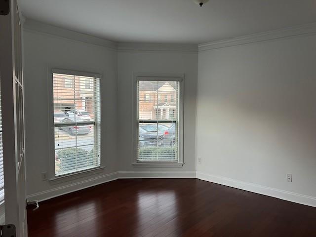 44 Kent Valley Circle Tucker, GA 30084 - Photo 5 of 6 a view of an empty room with wooden floor and a window