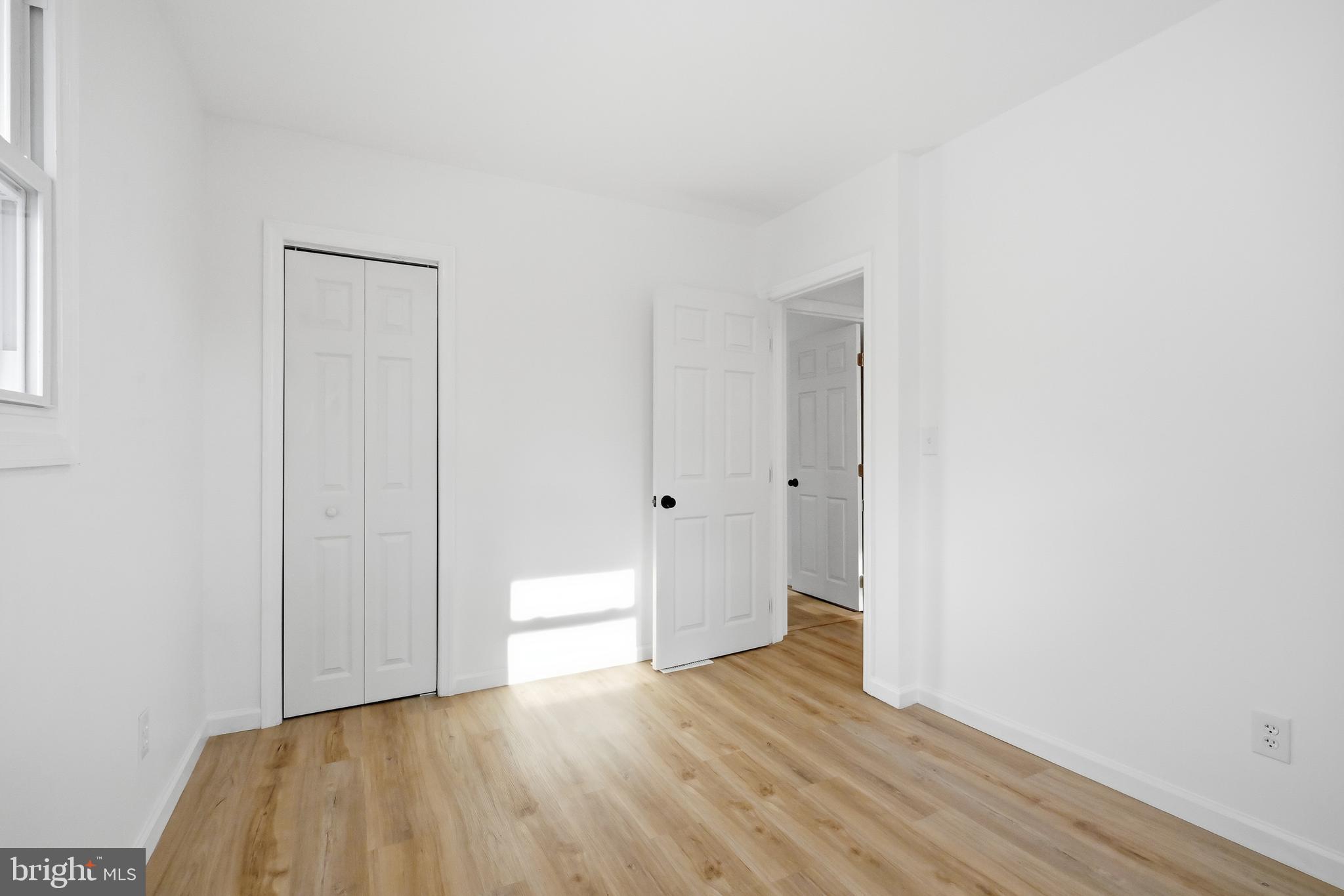 4740 Lake Road Newfield, NJ 08344 - Photo 17 of 29 a view of an empty room and wooden floor