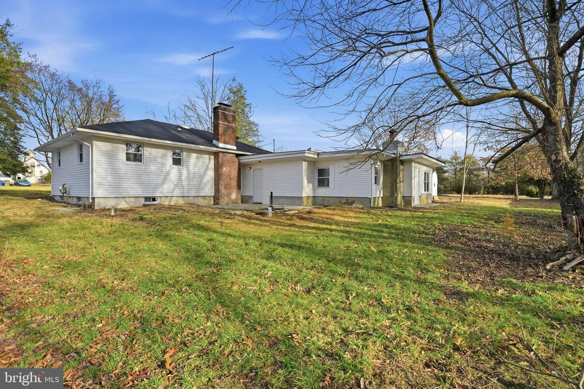 4740 Lake Road Newfield, NJ 08344 - Photo 27 of 29 a white house that has a big yard with large trees