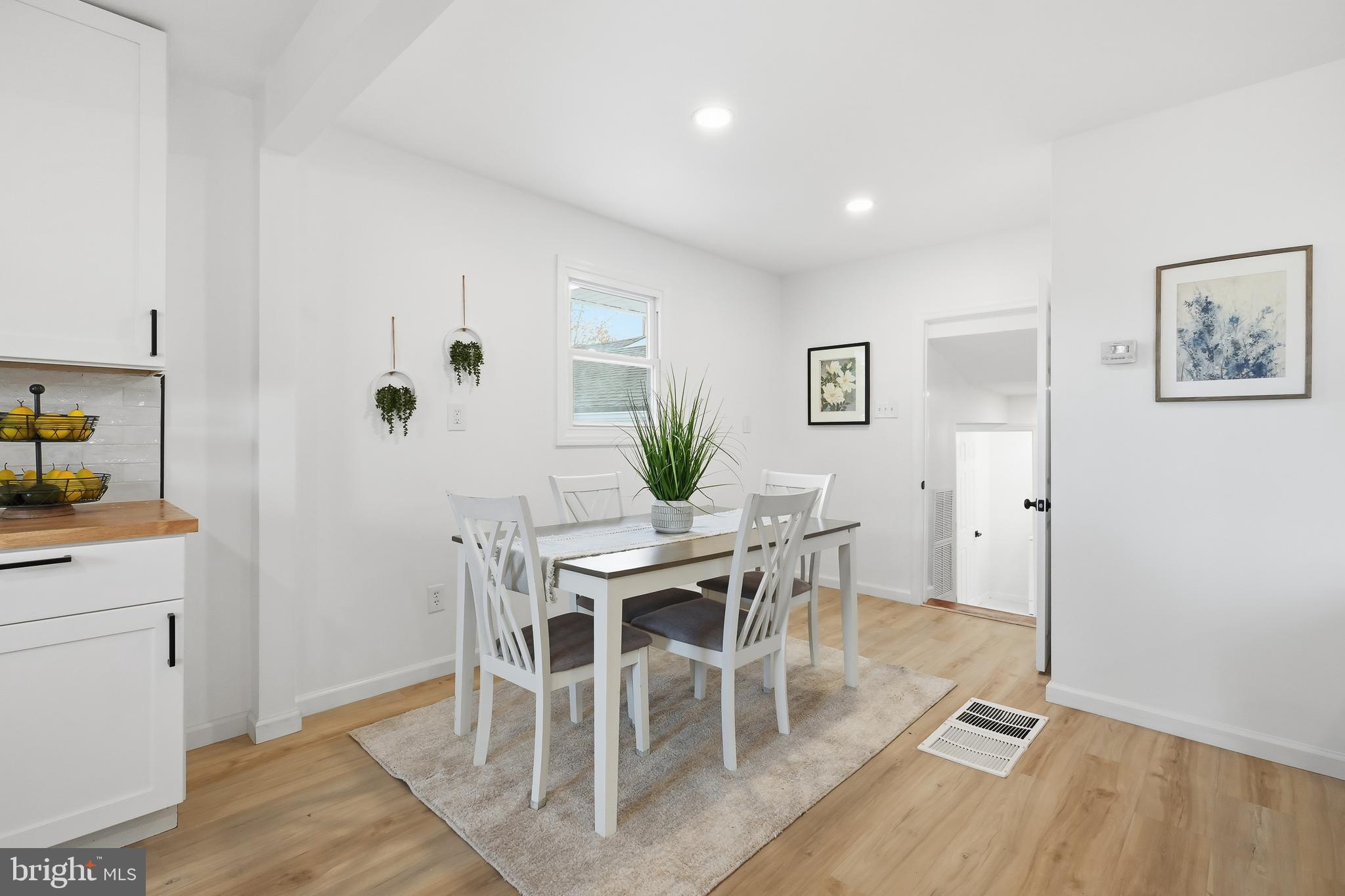4740 Lake Road Newfield, NJ 08344 - Photo 8 of 29 a view of a dining room with furniture and wooden floor