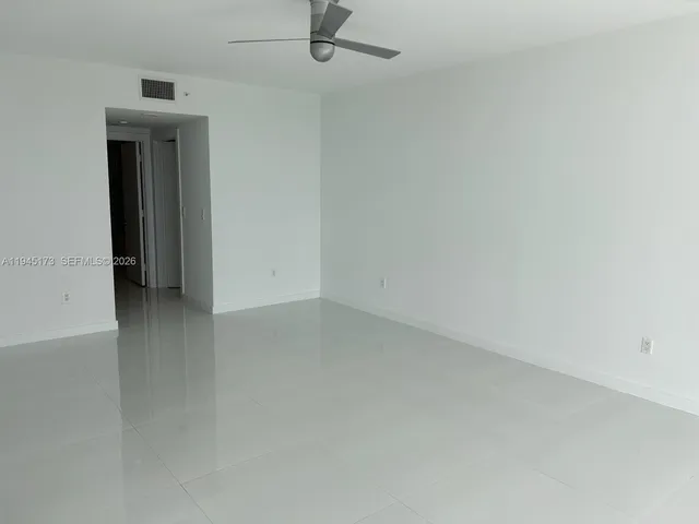 a spacious bathroom with a bathtub and a shower