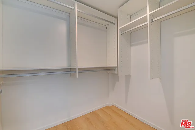 a view of an empty walk in closet