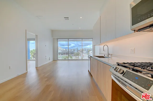 a kitchen with wooden floors and a stove