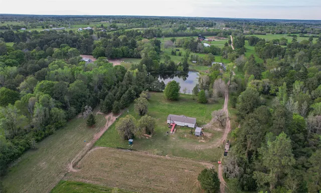 an aerial view of a house with mountain view
