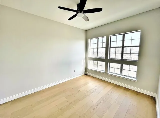 a view of an empty room with a bathroom