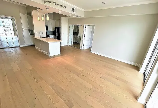 a view of kitchen with furniture and refrigerator